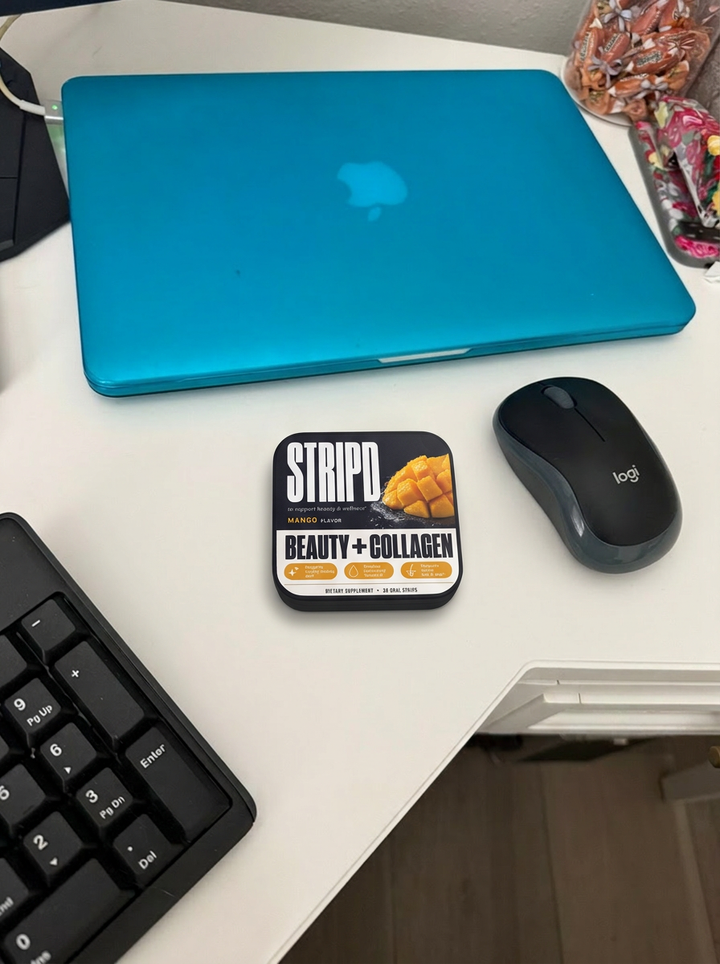 Stack of all three STRIPD tins on a table